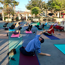 Universal Studios Hollywood Team Members take time to relax and stretch on their yoga mats