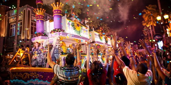Mardi Gras-themed parade float with cheering crowd