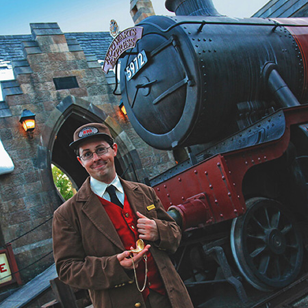 Train Conducter in front of the Hogwarts Express in Islands of Adventure