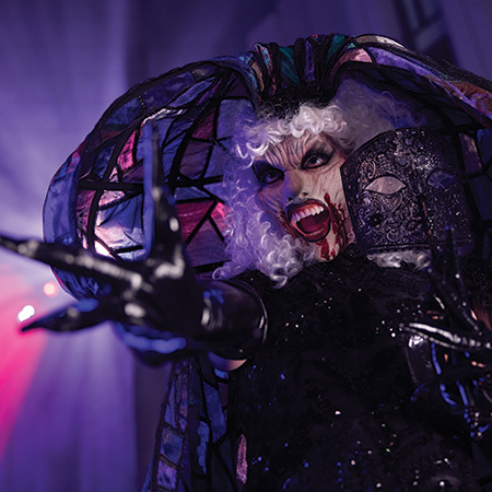 Performer at Halloween Horror Nights reaching at the camera