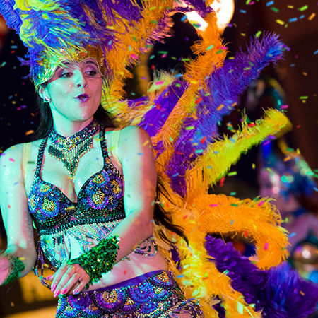 Performer dancing in the Mardi Gras parade at Universal Srudios Florida